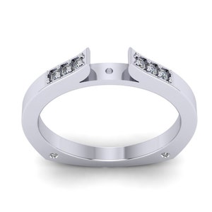 May include: A silver ring with a split band and small diamonds set along the top edge. The ring is designed to hold a center stone.