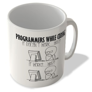 May include: White ceramic mug with a black graphic and text. The text reads "PROGRAMMERS WHILE CODING IT DOESN'T WORK...WHY? IT WORKS...WHY?" The graphic depicts two stick figures at computers.