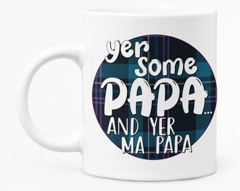 May include: White ceramic mug with a blue and purple tartan circle design. The text "yer some PAPA... and yer ma PAPA" is written in white on the circle.