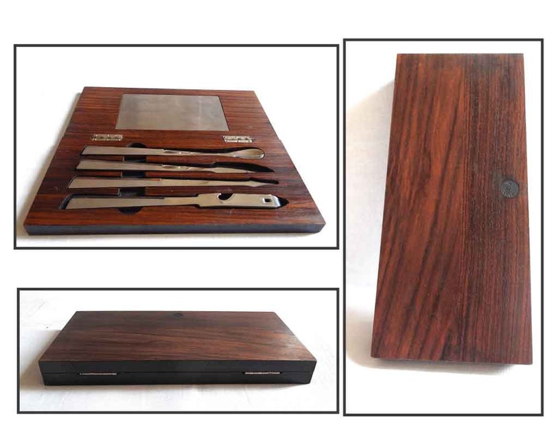 Peut inclure: Un ensemble de quatre outils en argent dans une bo&icirc;te en bois avec un grain de bois fonc&eacute;. Les outils sont dispos&eacute;s en rang&eacute;e et ont tous la m&ecirc;me longueur. La bo&icirc;te a un couvercle &agrave; charni&egrave;res et une petite plaque m&eacute;tallique &agrave; l'int&eacute;rieur.