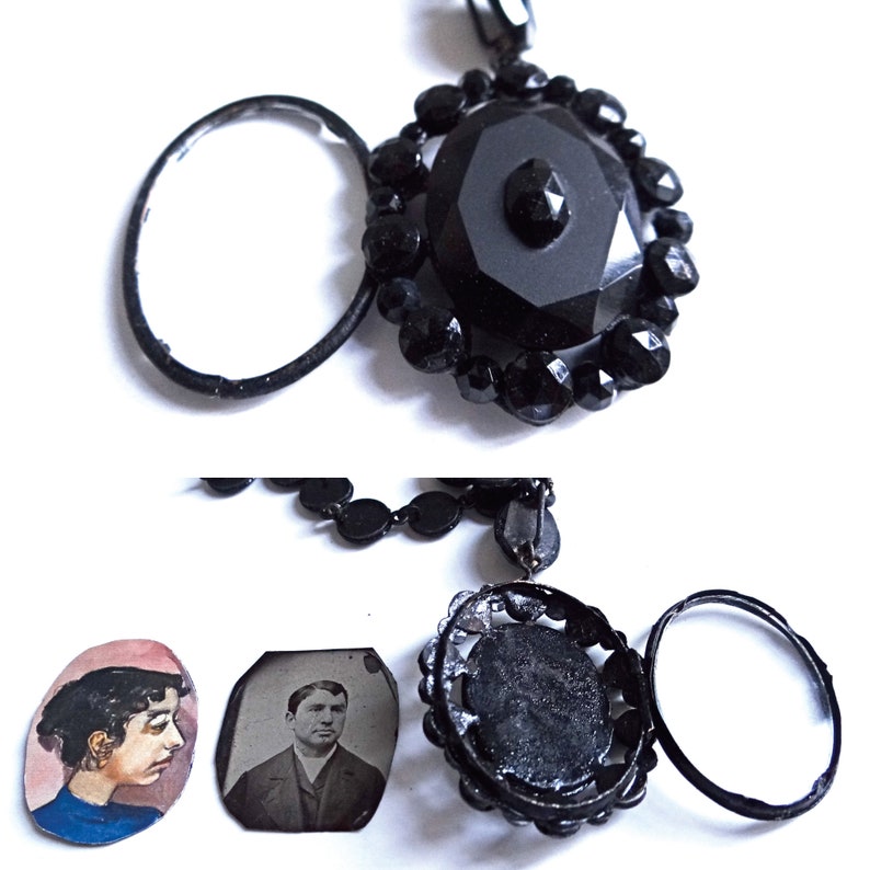 May include: A black jet necklace with a large black glass pendant and two smaller black glass pendants. The necklace is made of black glass beads and has a black metal clasp.