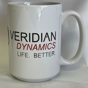 May include: White ceramic mug with a black and red logo that says "Veridian Dynamics" and "Life. Better."
