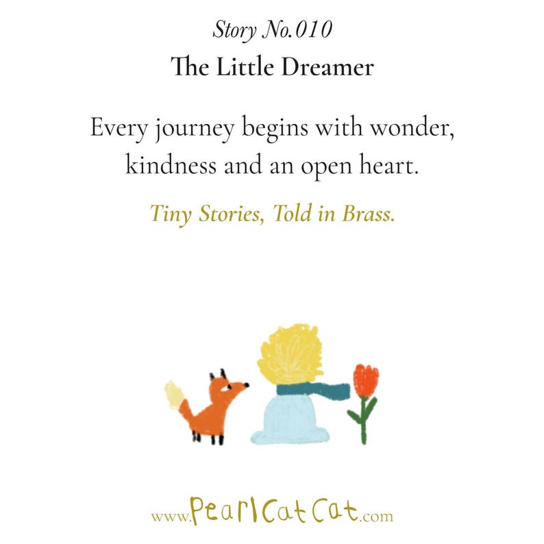 May include: A white card featuring the text Story No. 010 The Little Dreamer, Every journey begins with wonder, kindness and an open heart, Tiny Stories, Told in Brass. Below is a colourful illustration of a fox, a person, and a red flower.