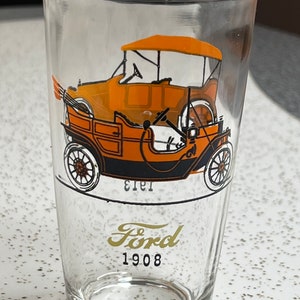 Vintage automotive glass tumbler featuring 1908 Ford 1913 Chevrolet Chevy