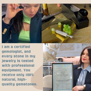 May include: A woman holds a certificate of gemology, a document that certifies her as a gemologist. The certificate is framed and has a gold seal. The woman is wearing a black blazer and a white shirt. She is standing in front of a marble statue.