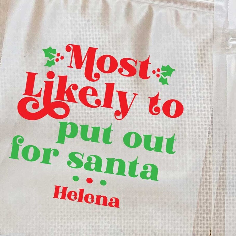 May include: White Christmas party game favor bag with green holly and red text that reads "Most Likely to put out for Santa... Helena".