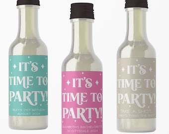 May include: Three small glass bottles with labels that say "It's Time to Party!" in a retro font. The labels are in different colors: teal, pink, and beige. The text on the labels includes the occasion, date, and location of the event.