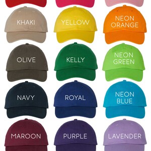 May include: A collection of 15 baseball caps in various colors, including red, pink, khaki, yellow, orange, olive, kelly green, navy, royal blue, neon blue, maroon, purple, lavender, black, gray, and white. The caps are arranged in a grid pattern with the color name printed on each cap.