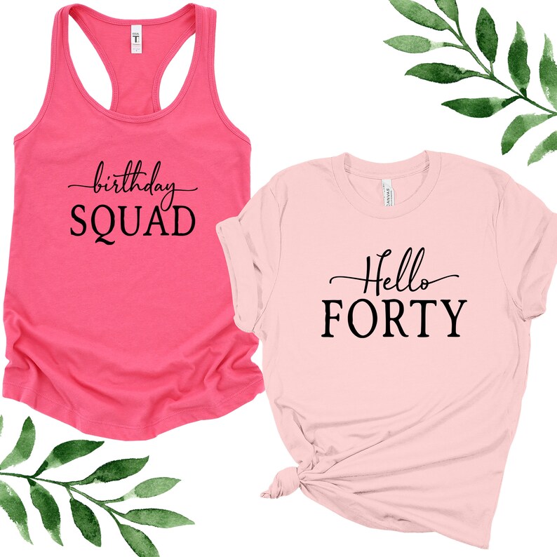 May include: Two shirts with birthday party text. A pink tank top with the text "birthday SQUAD" and a pink t-shirt with the text "Hello FORTY".
