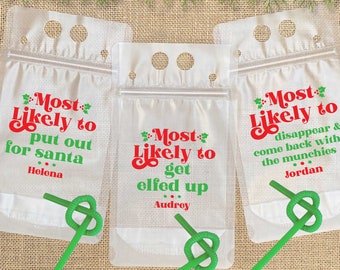May include: Three clear plastic bags with red and green text that reads "Most Likely to" followed by a different phrase on each bag. The phrases are "put out for santa", "get elfed up", and "disappear & come back with the munchies". Each bag has a green straw and a name written below the phrase.