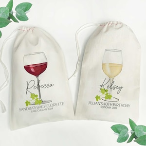 May include: Two white cotton wine bags with red and white wine glasses printed on them. The bag on the left has the name "Rebecca" and the text "Sandra's Bachelorette Lake Chelan 2024". The bag on the right has the name "Kelsey" and the text "Jillian's 40th Birthday Sonoma 2024".