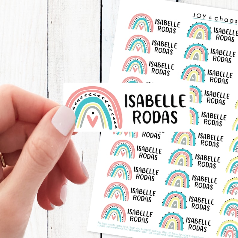 May include: A sheet of colorful rainbow stickers with the name "Isabelle Rodas" printed on each sticker. The stickers are perfect for adding a touch of whimsy to any project.
