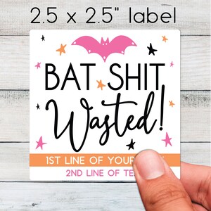 May include: A square label with the text "BAT SHIT Wasted!" in black, with a pink bat and star accents. The label is 2.5 x 2.5 inches and has space for custom text.