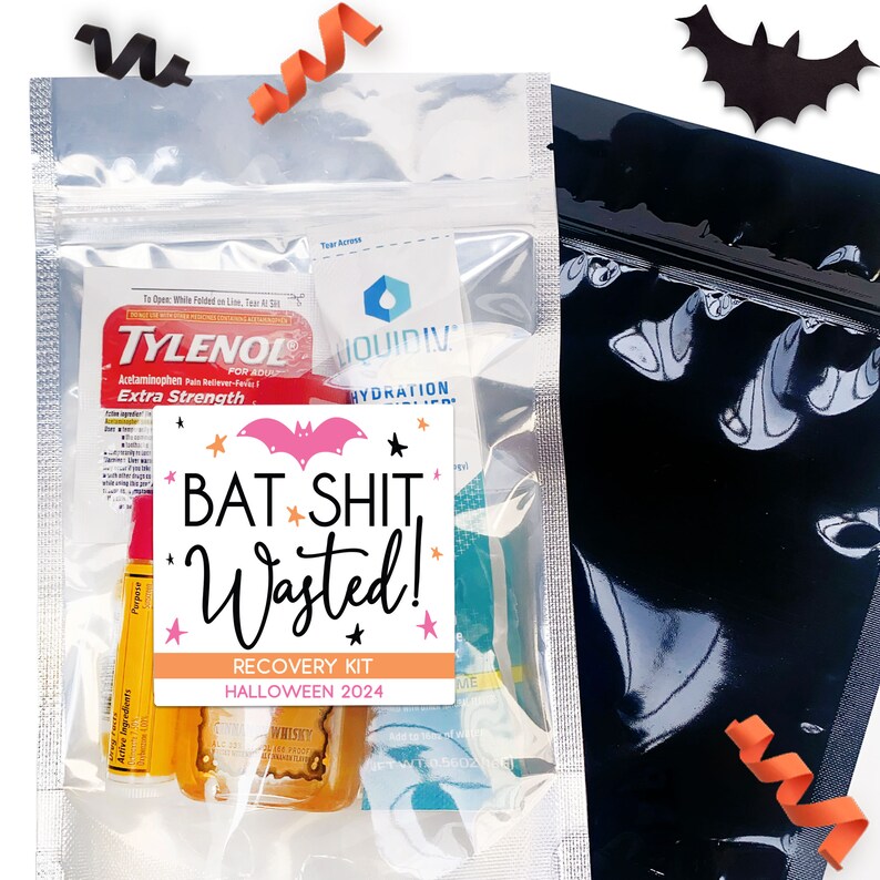 May include: A clear, sealed bag containing a Halloween recovery kit. The kit includes Tylenol, Liquid IV, and a small bottle of whiskey. The label reads "BAT SHIT, Wasted! RECOVERY KIT HALLOWEEN 2024" with a pink bat graphic.