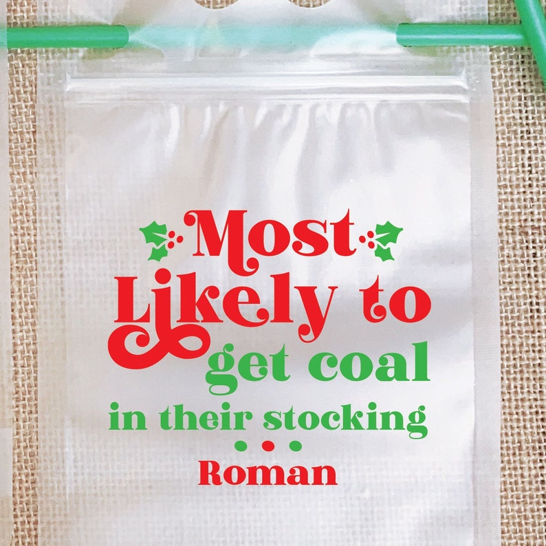 May include: A clear plastic bag with a red and green design that says "Most Likely to get coal in their stocking Roman".