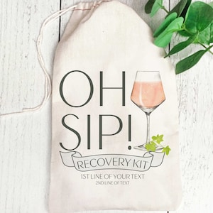 May include: White canvas bag with a drawstring closure. The bag has a graphic of a glass of pink wine with the text "Oh Sip! Recovery Kit" and "1st line of your text 2nd line of text".