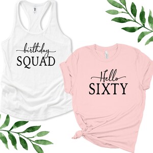 May include: Two shirts, one white tank top with the text "birthday SQUAD" and one pink t-shirt with the text "Hello SIXTY".