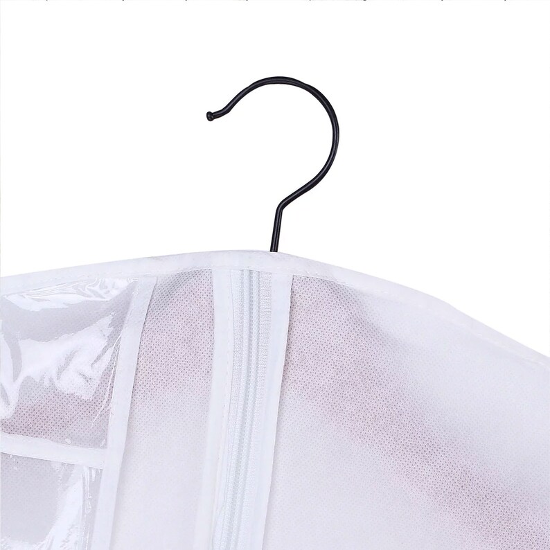 May include: White garment bag with a zipper closure and a clear plastic window. The bag has a black metal hanger.