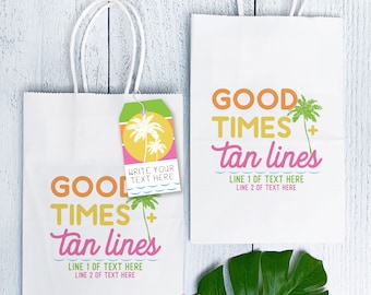 May include: Two white paper gift bags with handles, one with a tag. Both bags have the text "GOOD TIMES + tan lines" in pink, yellow, and orange. The tag has a palm tree graphic and the text "WRITE YOUR TEXT HERE".