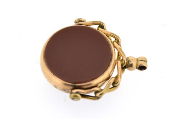 An antique, round shaped 9ct gold swivel fob with… - image 4