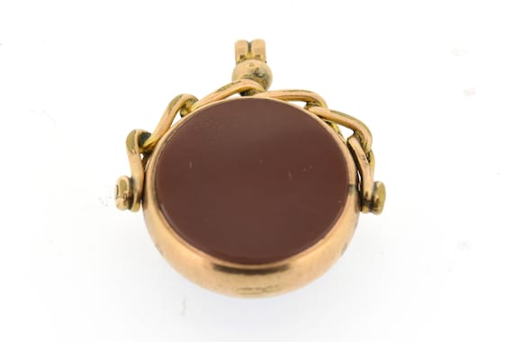 An antique, round shaped 9ct gold swivel fob with… - image 1