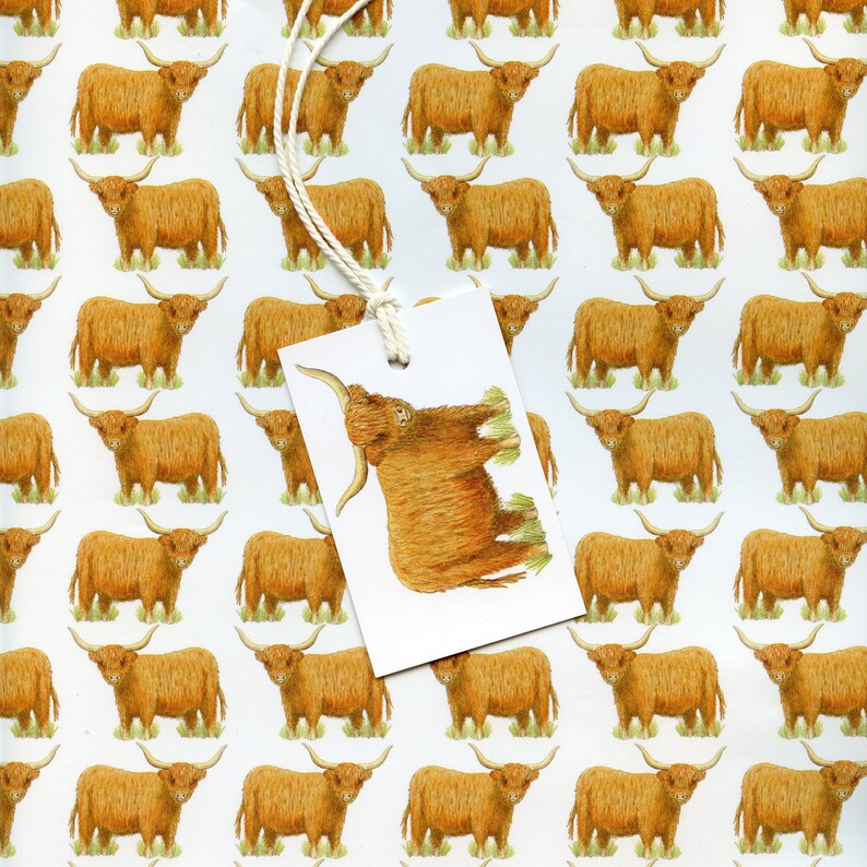 May include: White wrapping paper with a repeating pattern of brown Highland cows. A white tag with a drawing of a Highland cow is attached with a string. The tag is angled, partially obscuring the pattern.