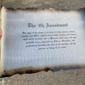 May include: A close-up of a parchment-like document with the text "The 4th Amendment" and the text of the 4th Amendment of the United States Constitution.