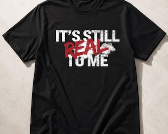 Maglietta da wrestling "It's Still Real To Me", grafica per fan degli anni '90.