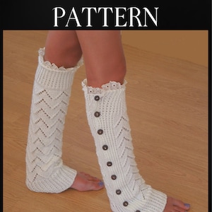 May include: A pair of white knitted leg warmers with a lace trim and button details. The leg warmers have a chevron pattern and are displayed on a person's legs. The text "LEG WARMERS KNITTING PATTERN" and "Sarah Taylor" are visible.