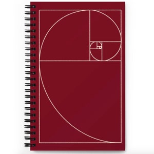 May include: A burgundy spiral bound notebook with a white spiral binding. The cover features a white outline of the golden ratio spiral.