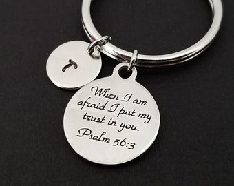 May include: Silver keychain with a round charm that says "When I am afraid I put my trust in you. Psalm 56:3" and a smaller round charm with the letter "J" on it.