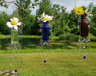 Glass bud vase window decor. Boho style sun catcher available in 3 colors. A hanging vase suitable for flowers or to root cuttings.