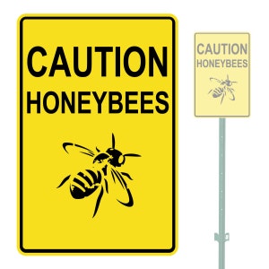 May include: A yellow caution sign with black text and a black silhouette of a honeybee. The sign reads "CAUTION HONEYBEES".