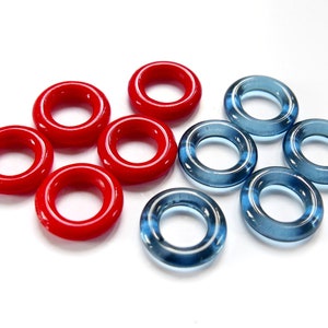 May include: A set of ten glass rings, five red and five blue. The rings are all the same size and shape, and they are arranged in a circle.