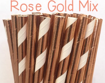 May include: A bunch of rose gold and white striped paper straws. The straws are in a clear glass jar. The text "Rose Gold Mix" is at the top of the image.