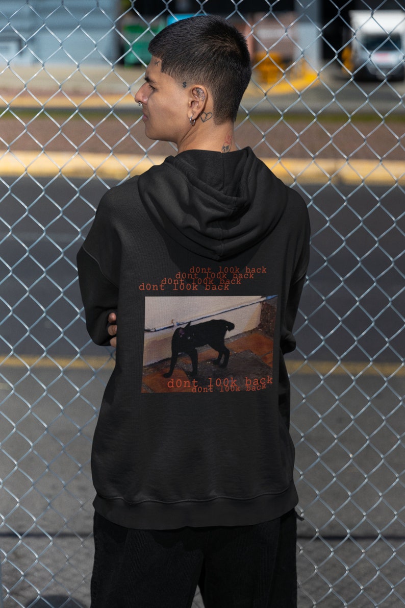 May include: Black hoodie with a graphic of a black cat and the text "dont look back" repeated multiple times.