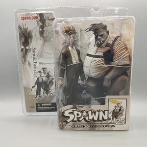 May include: Collectible action figures of Sam and Twitch from the Spawn comic series, packaged in clear plastic. The figures are in a sepia tone, with one figure in a suit and the other in overalls. The packaging includes the text "Spawn" and "The Classic Comic Covers".