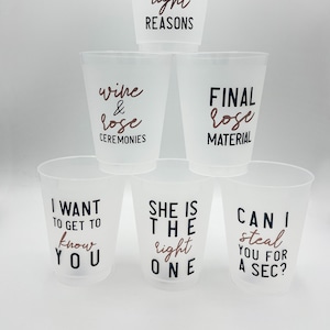 May include: Six clear plastic cups with black and rose gold text. The cups have different sayings on them, including "Here for the right reasons", "Wine & Rose Ceremonies", "Final Rose Material", "I Want to Get to Know You", "She is the Right One", and "Can I Steal You for a Sec?"