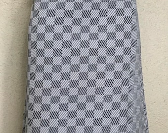 May include: A gray and white checkered skirt with a straight cut and a button detail on the front pockets.