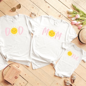 Your little one is sure to love this Sun Shine themed birthday shirt on their first birthday. Especially if the whole family joins in on the fun. Perfect for your little ones Sun themed 1st birthday party. T-Shirts & Onesie Bodysuit. Mommy and Me Set