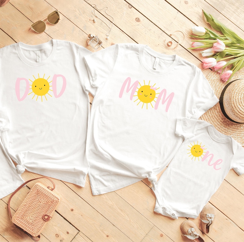 Your little one is sure to love this Sun Shine themed birthday shirt on their first birthday. Especially if the whole family joins in on the fun. Perfect for your little ones Sun themed 1st birthday party. T-Shirts & Onesie Bodysuit. Mommy and Me Set