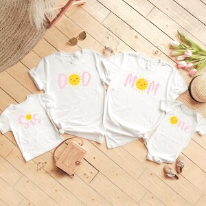 Your little one is sure to love this Sun Shine themed birthday shirt on their first birthday. Especially if the whole family joins in on the fun. Perfect for your little ones Sun themed 1st birthday party. T-Shirts & Onesie Bodysuit