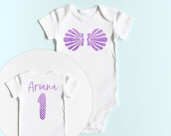 Mermaid First Birthday ONESIES® with a Sea Shell Bra on the front.  Mermaid Theme Birthday. Mermaid Bday Shirt. Under the Sea Bday ONESIES®