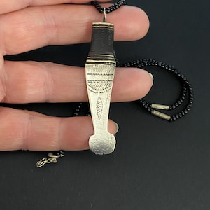 Tuareg tribe necklace with pendant, signed by the maker on the back, hand etched design with ebony detail and hook clasp