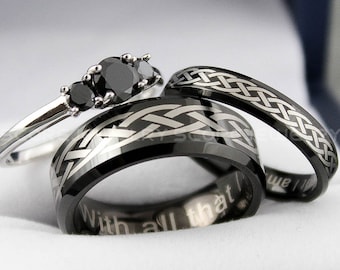 May include: A set of three black wedding bands with a Celtic knot design. The engagement ring features a three-stone black diamond setting. The inscription on the band reads "With all that we've"