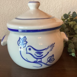 May include: White ceramic soup tureen with a blue and white bird design. The tureen has a lid and two handles.