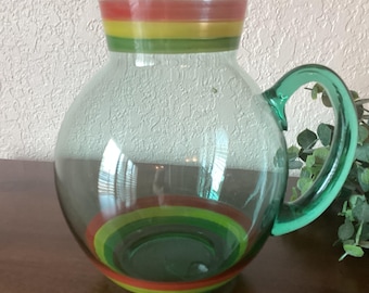 Hand blown green glass pitcher with painted accent stripes, vintage, excellent condition