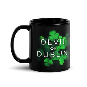May include: Black ceramic mug with a green shamrock design and the text "Devil of Dublin" in white.