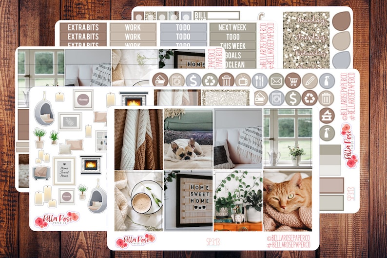 May include: A set of planner stickers featuring a cozy home theme. The stickers include images of a fireplace, a cat, a dog, a cup of coffee, plants, and a window. The stickers also include text such as "Home Sweet Home" and "Extra Bits".