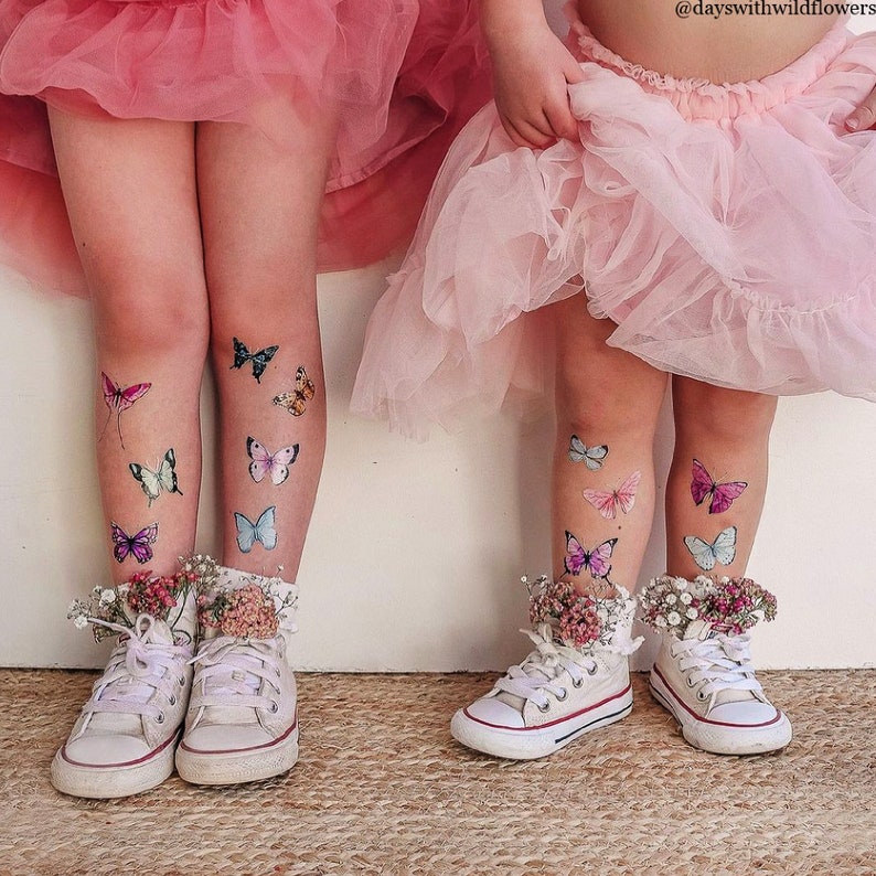 Girls wearing butterflies temporary tattoo transfers. Big set of 21 watercolor butterfly body stickers for kids.
